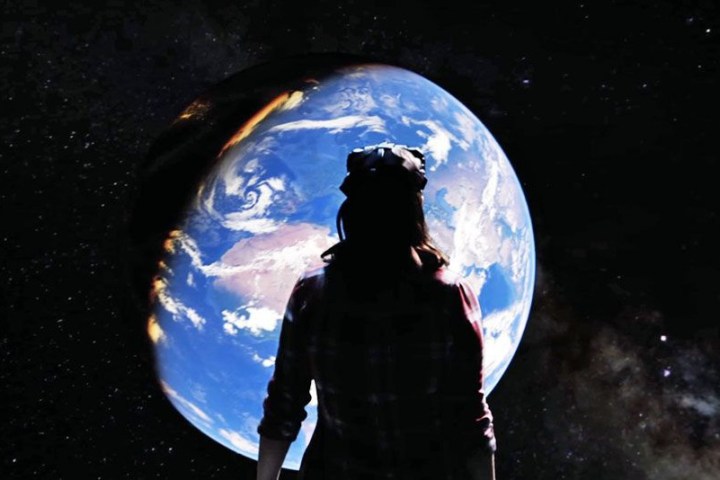 a person that is standing in the dark